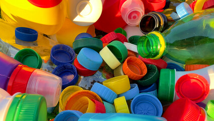 Recycling Plastic Bottle Caps. Plastic Material is Recyclable. Remove Lids from Plastic Bottles before Recycling. Plastic Waste Collection for Recycling. Drink Bottle caps to conversion and Reuse. - obrazy, fototapety, plakaty