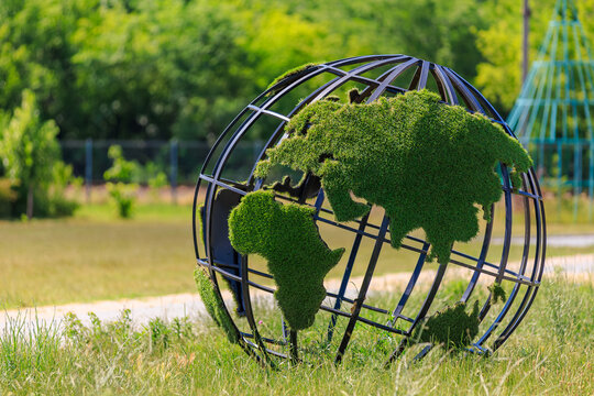 Green planet globe. Background with selective focus and copy space
