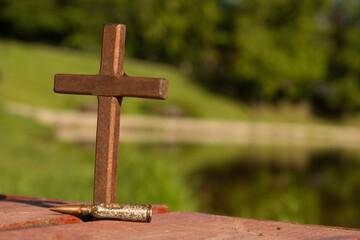 cross with patron on the street. Concept of war and death