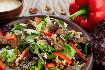 vegetarian salad with tofu, vegetables, and walnuts