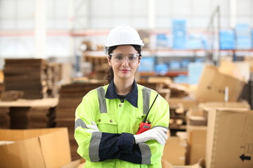 worker or engineer working in factory with safety uniform , safety hat and safety glasses , image is safety concept or happy workplace