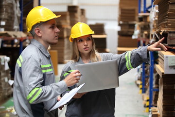 worker or engineer working in factory with safety uniform , safety hat and safety glasses , image is safety concept or happy workplace