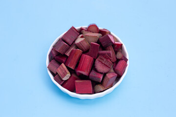 Fresh rhubarb on blue background.