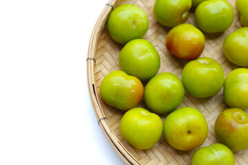 Fresh green plum fruit on white background.