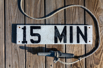 Round Pond Harbor, Maine, USA, 15 minute dock time sign posted on deck with anchor tie-down