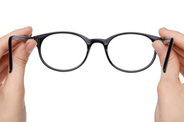 Woman holding stylish glasses with black frame on white background, closeup