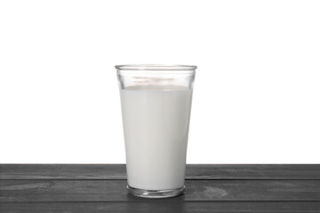 One glass of tasty milk on blue wooden table against white background