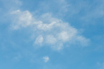 Blue sky with white soft high puffy clouds