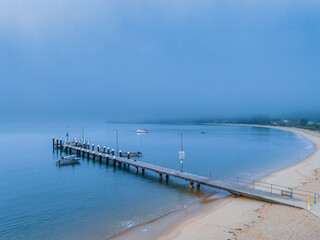 Fototapeta na wymiar One foggy morning over the bay