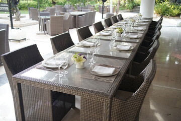 Neatly decorated table for celebration in grey colors. Selective focus.