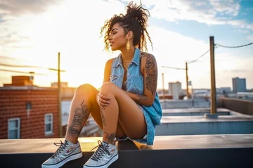Foto op Canvas Photo of a young african american female millennial on a rooftop, showcasing her tattoos and wearing denim cutoff shorts. With trendy style and urban vibe reflect a carefree and confident spirit © MVProductions