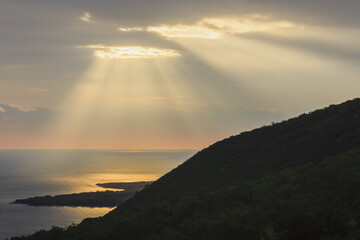 Hand Of Gold Lighting Over Pali (Cliff) On Kealakekua Bay; Kona, Island Of Hawaii, Hawaii, United States Of America