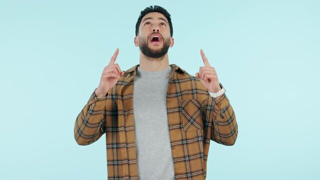 Mockup, man and pointing in studio for marketing, advertising or promo on blue background and yes gesture. Decision, person and choice or option for product placement of work presentation approval