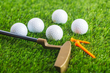 golf ball with orange tee in golf course 