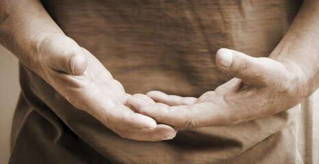 A Man Holding His Hands Out In Front Of Him; Vernon, British Columbia, Canada