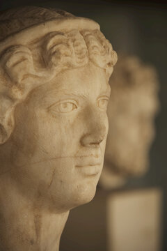 White Marble Head Of Female Statue Beside Male Statue; Athens, Attica, Greece