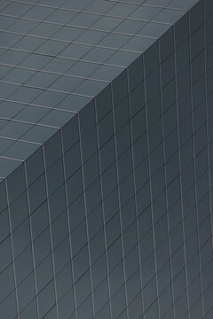 Geometric Pattern Of Windows On Grey Skyscraper; Hong Kong, China