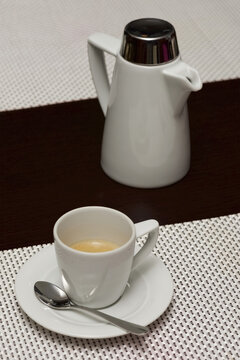 White Espresso Cup With Coffee Beside Pot; Ankara, Turkey