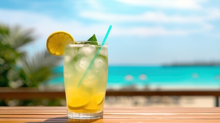 Summer cocktail with lemon drink blur beach background