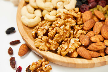 mixed nuts in bowl,Nut foods, various mixed nuts, raisins, walnuts, almonds, black rice, peanuts, milk, vitamin supplement foods