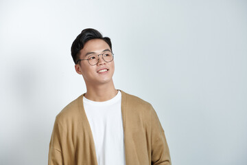 Portrait of young Asian man on background