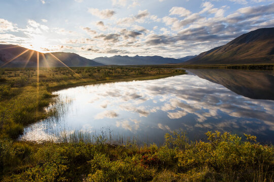 Clouds reflected in noatak river and brooks range gates of the arctic national park northwestern alaska; Alaska united states of america