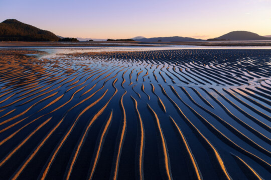 Ripples created by the action of wind, water and tides are revealed as the evening tide receeds, Eagle Beach State Recreation Area (near Juneau), Alaska.