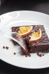 slice of brownie on plate on table 