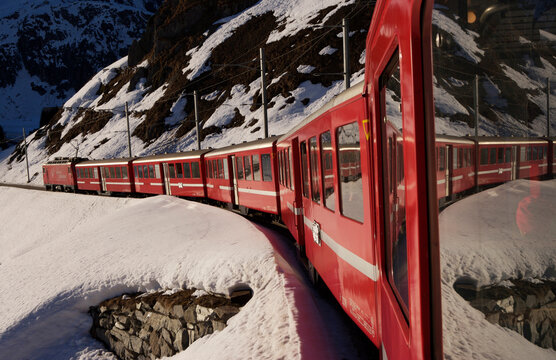 Glacier Express train in the Swiss Alps between Sedrun and Andermatt; Andermatt, Switzerland