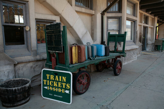 Cart loaded with suitcases at a train station; French Lick, Indiana, United States of America