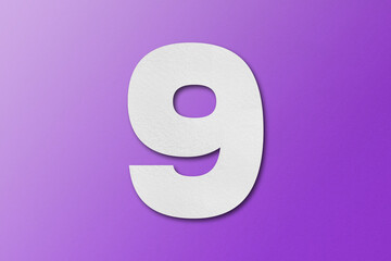 White paper font number 9 isolated on purple background.