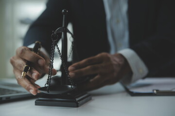 Business and lawyers discussing contract papers with brass scale on desk in office. Law, legal...