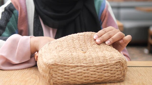  women taking smart phone our from her casual purse 