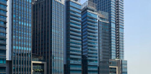 Modern office skyscrapers ,high rise buildings with glass facades.