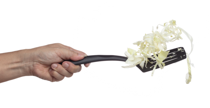 Cabbage fly in turner, green fresh vegetable cabbage cut chop slice food. Organic fresh vegetable with eaten leaf of cabbage falling, close up texture. White background isolated freeze motion