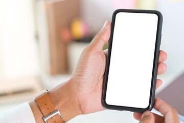 Man hands holding smart phone with blank screen for your text message or information content.