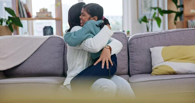 Hug, family and living room sofa with love, bonding and support of a mother and young girl. Happy, care and mom with a child together at home in a lounge with a smile of a kid and mama on a couch