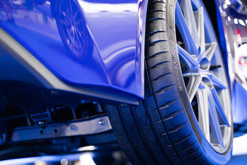 Details about the wheels of a blue super sports car, luxury car