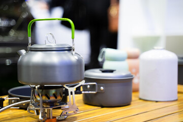 Tourist kettle on a portable gas stove, compact device. camping equipment Camping equipment is on...