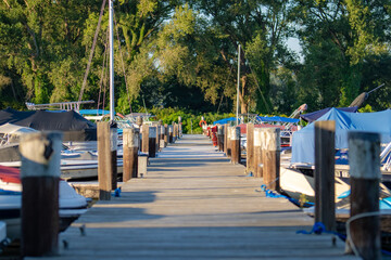 Looking down a long wooden dock at Allan H Treman State Marine Park, Ithaca, NY, USA..  