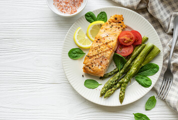 Baked Delicious salmon, green asparagus on  plate