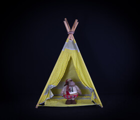 wigwam for children on a black background © serikbaib