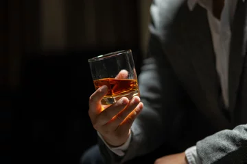 Poster Bartender pours whiskey to customer in tavern © Thitisak