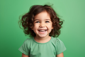 Studio portrait of cuttle little laughing girl on different colours background - obrazy, fototapety, plakaty