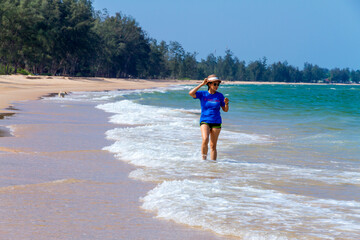 Woman walk relax at beach Bang Boet