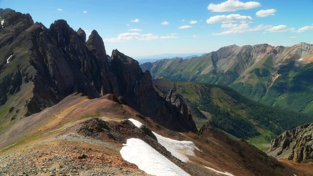 Southern Colorado summer snowy dreamy Rocky Mountains San Juan top of peaks Ice Lake Basin Trail toward  Silverton Telluride Ouray Red Mountain Molas Pass top of the world slow pan still movement