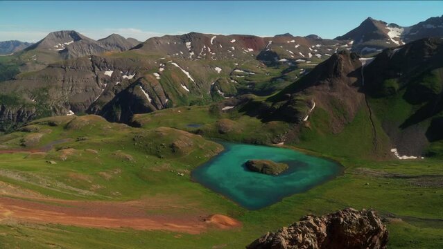 Summer Southern Colorado top of Rocky Mountain Peaks view of upper Island Lake San Juans Silverton Telluride Ice Lake Basin Trail dreamy stunning peaceful landscape pan to the left movement