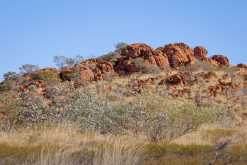 A rocky outcrop rising above the Australian bush in Northern Queensland, Australia