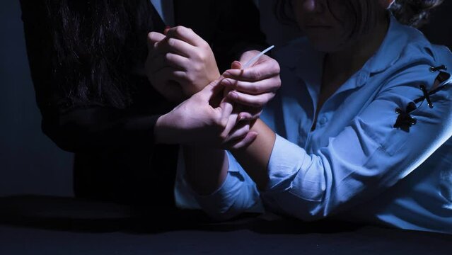 Suspect With Hands In Plastic Handcuffs Tells.