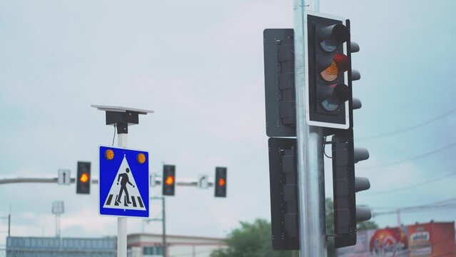 An Traffic lights and city crossings for safety, traffic intersection safety warning signs and traffic lights to prevent danger from cars on the road.